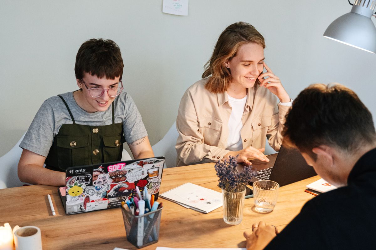 Two people reviewing a screen